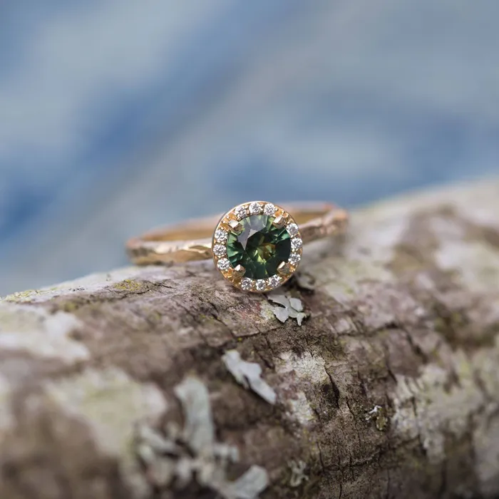 Anueva Jewelry Rings Diamond and Green Sapphire Engagement Ring in Hand Carved Recycled Yellow Gold Earthy Setting Emerald Sapphire Engagement Ring by Anueva Anueva Jewelry Rings Diamond and Green Sapphire Engagement Ring in Hand Carved Recycled Yellow Gold Earthy Setting Emerald Sapphire Engagement Ring by Anueva