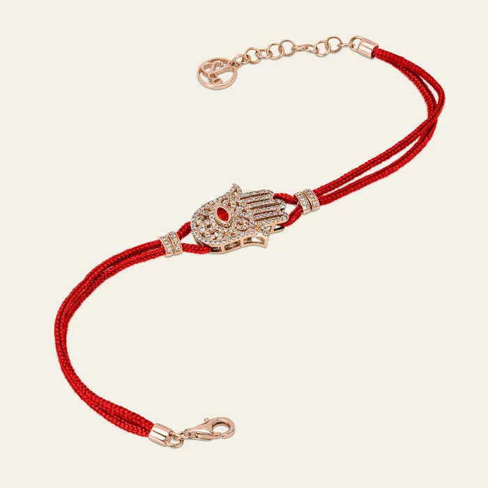 Hand crafted in 18k rose gold and set with 166 highquality round brilliant cut white diamonds and marquise ruby Bracelets Hamsa Diamond Bracelet